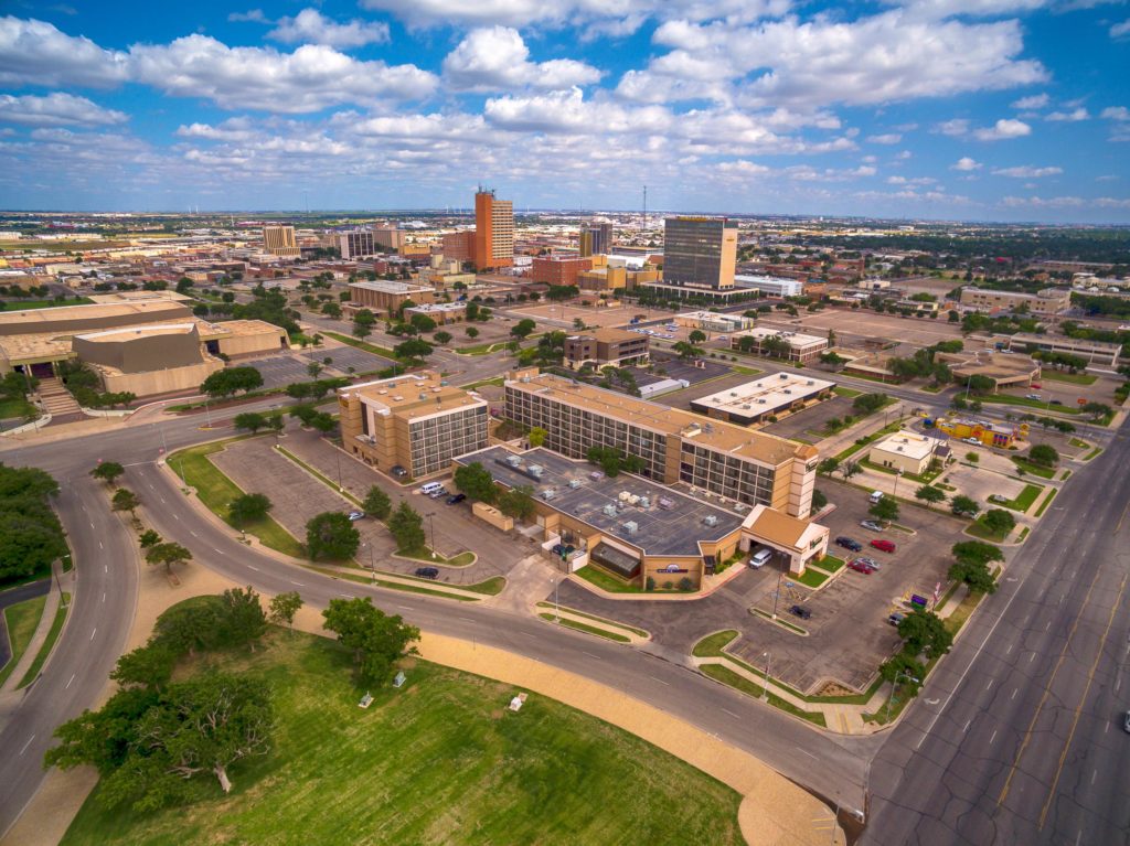 Blue sky Aerial Photo of MCM Elegante Lubbock with Downtown Lubbock in the background